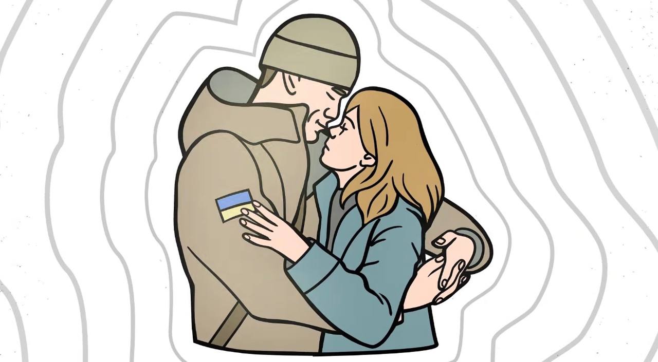 військовий обіймає жінку
